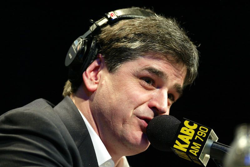 Sean Hannity speaking into a microphone while wearing a headset. Sean Hannity speaking into a microphone while wearing a headset.