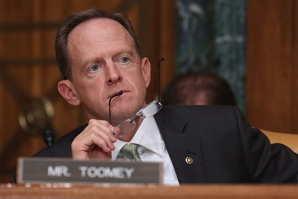 Senate Budget Committee member Sen. Pat Toomey (R-PA) listens to testimony from Congressional Budget Office Director Keith Hall