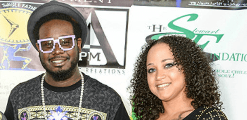 T-Pain and Amber Najm smile at a red carpet event. T-Pain and Amber Najm smile at a red carpet event.
