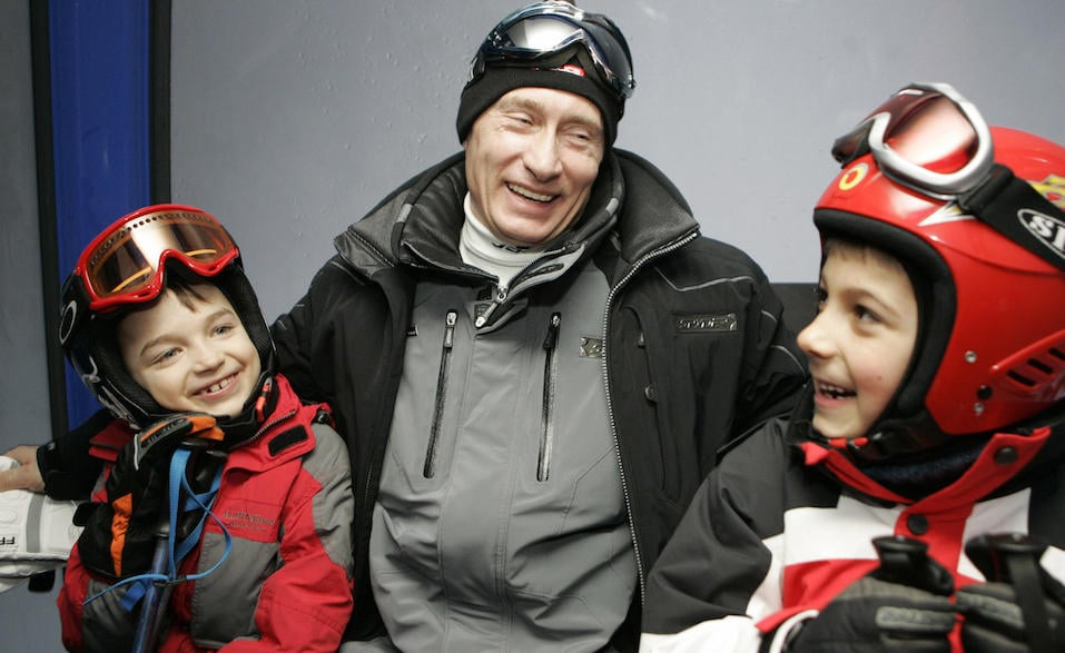 Russian President Vladimir Putin speaking with children at the Krasnaya Polyana skiing centre