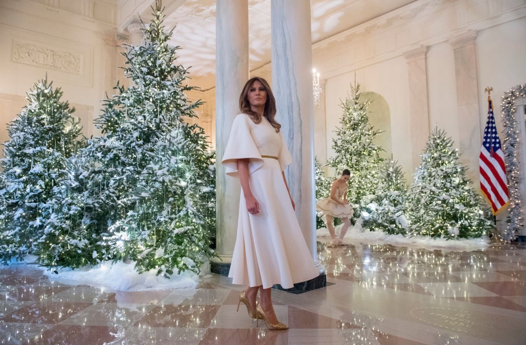 Melania Trump stands in the Grand Foyer with Christmas Decorations US First Lady Melania Trump stands in the Grand Foyer
