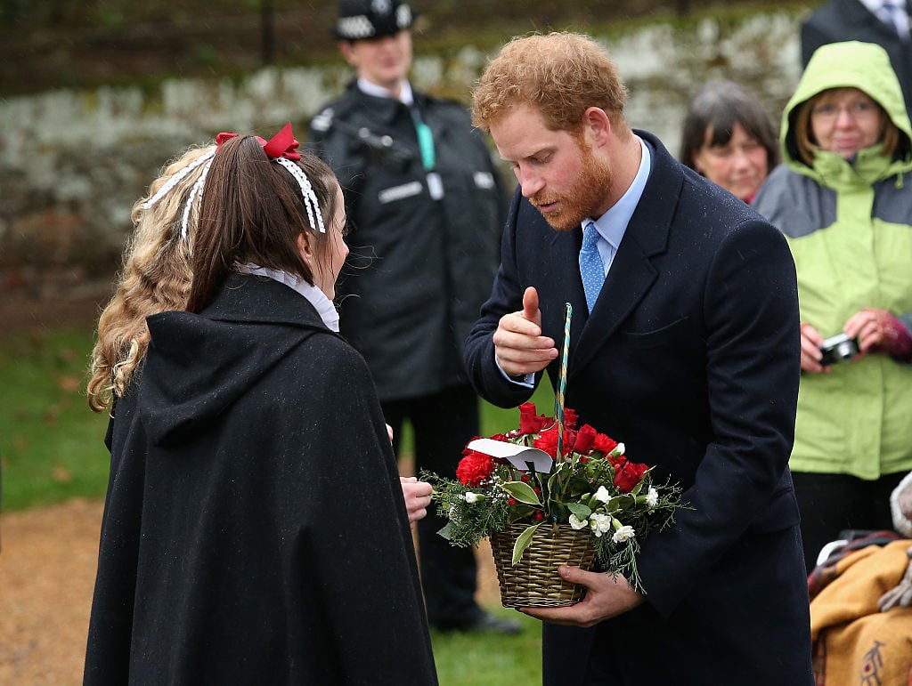 Prince Harry meets members of the public as he attends a Christmas Day church service.