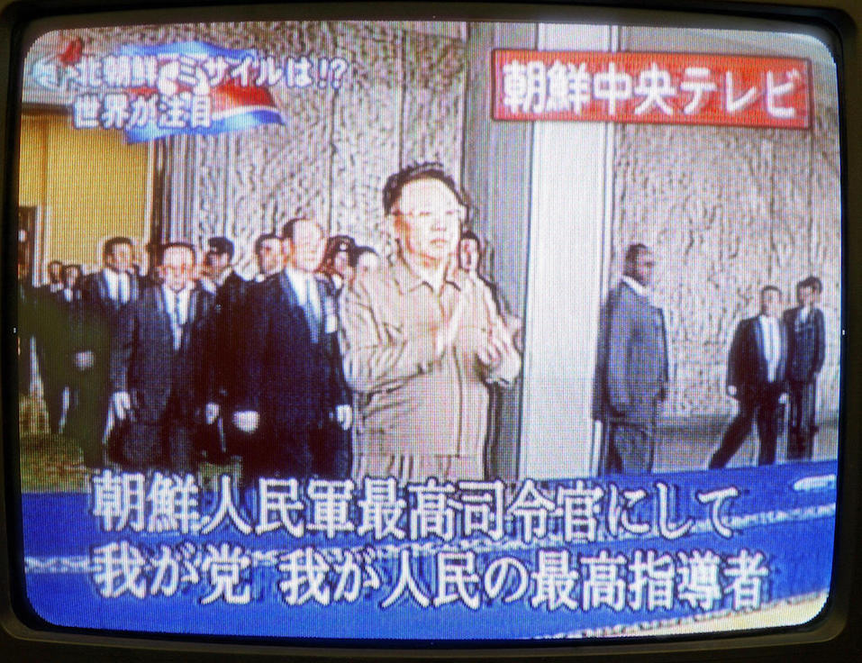Japanese television shows North Korean leader Kim Jong-Il (C) appearing to observe a parade