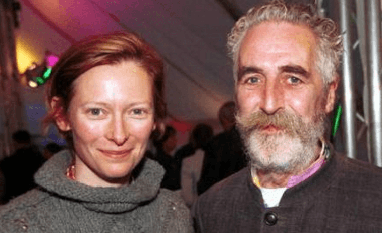 Tilda Swinton and John Byrnepose together at an event.