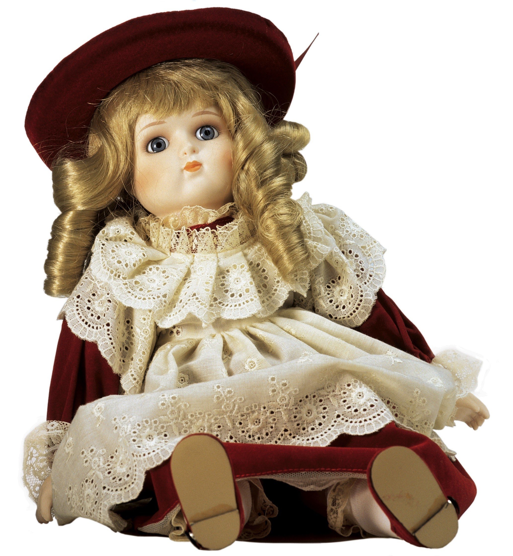 Porcelaine doll in red dress