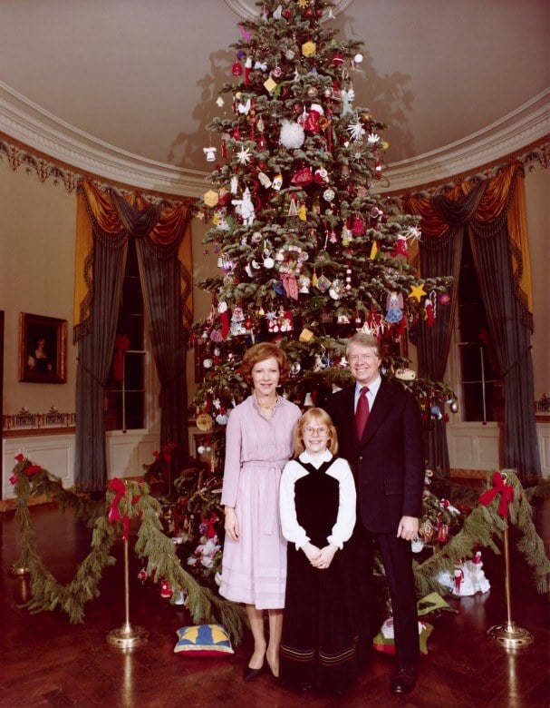 the carter family in front of their christmas tree the carter family in front of their christmas tree