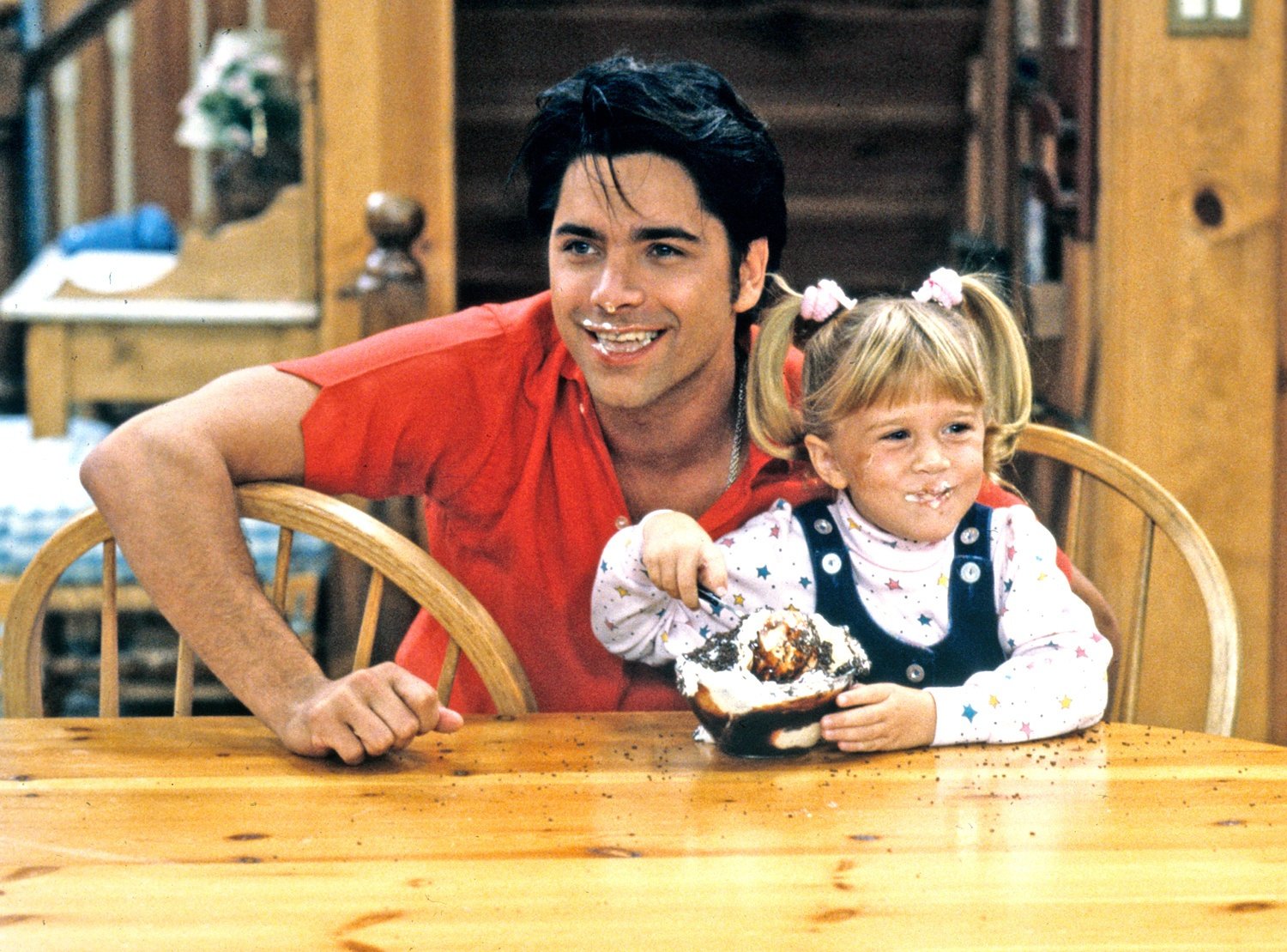 John Stamos with an Olsen twin on Full House