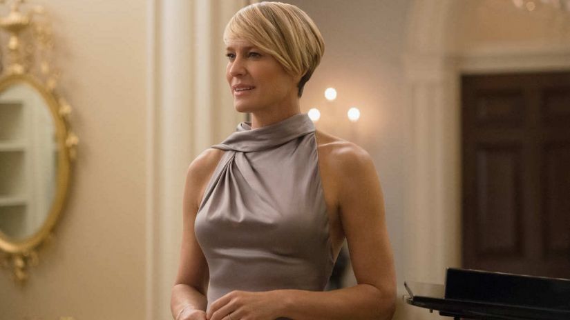 Claire Underwood stands in a gown