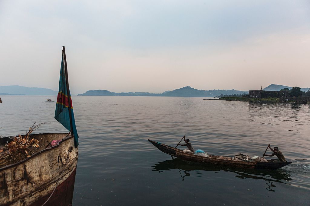 man on a canoe in a lake man on a canoe in a lake