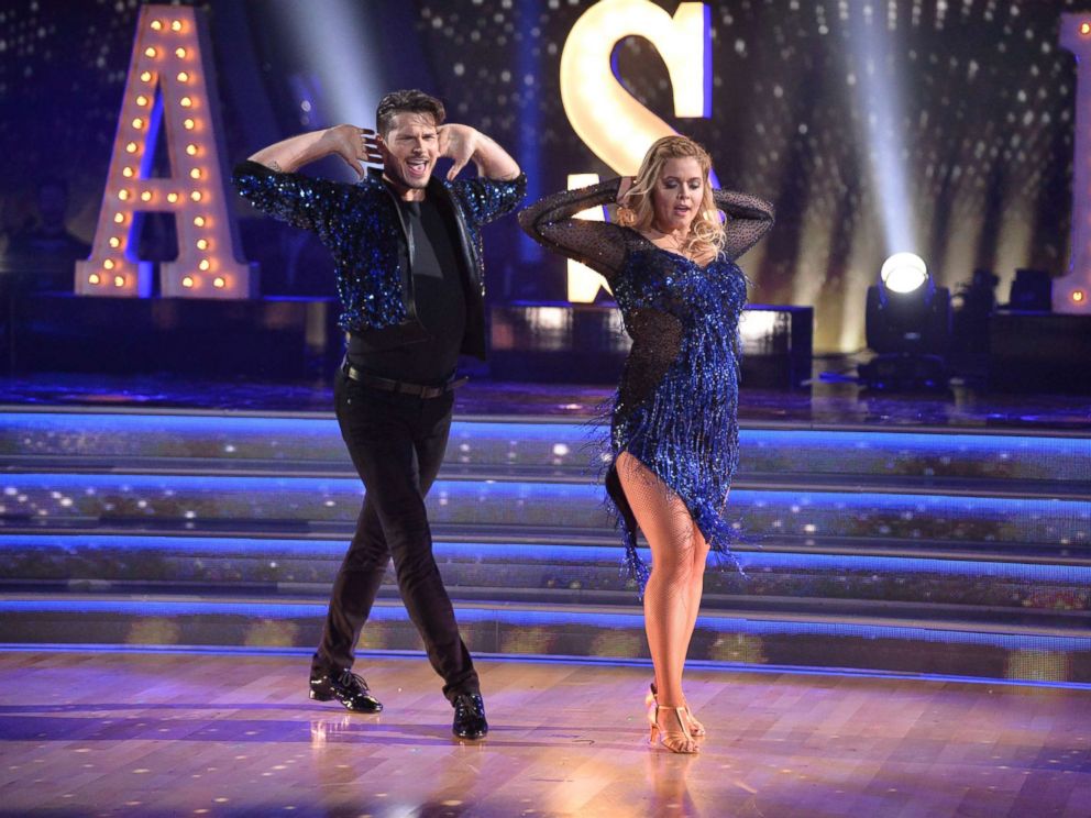 Sasha Pieterse and Gleb Savchenko dancing in blue costumes Sasha Pieterse and Gleb Savchenko dancing in blue costumes