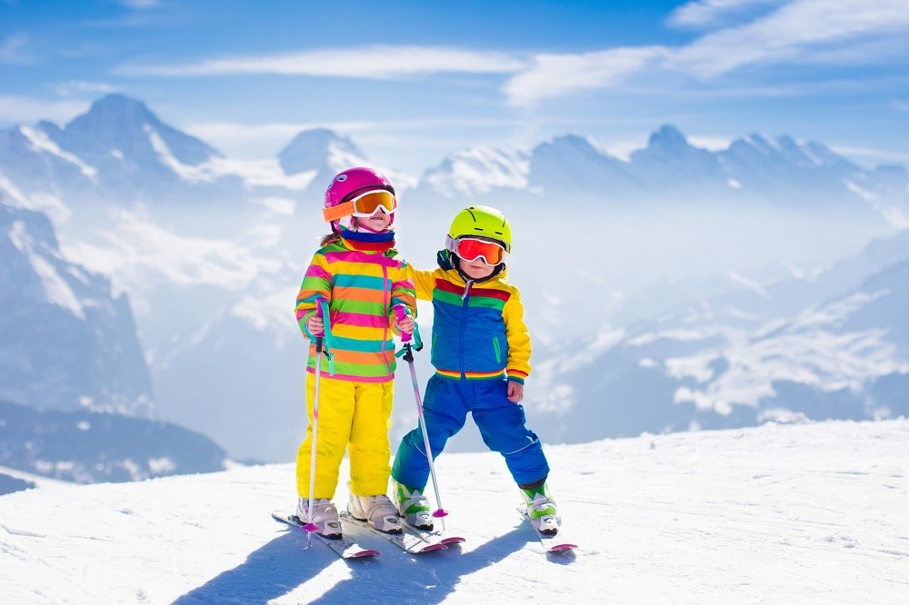 Kids skiing in mountains Kids skiing in mountains