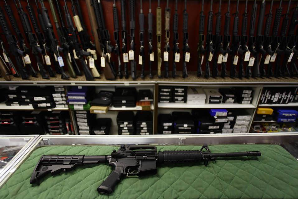 Colorado Community Mourns In Aftermath Of Deadly Movie Theater Shooting A Bush Master AR15 assault rifle