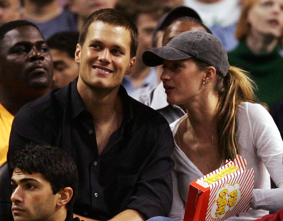 Tom Brady of the New England Patriots and Gisele Bündchen watch as the Detroit Pistons play against the Boston Celtics