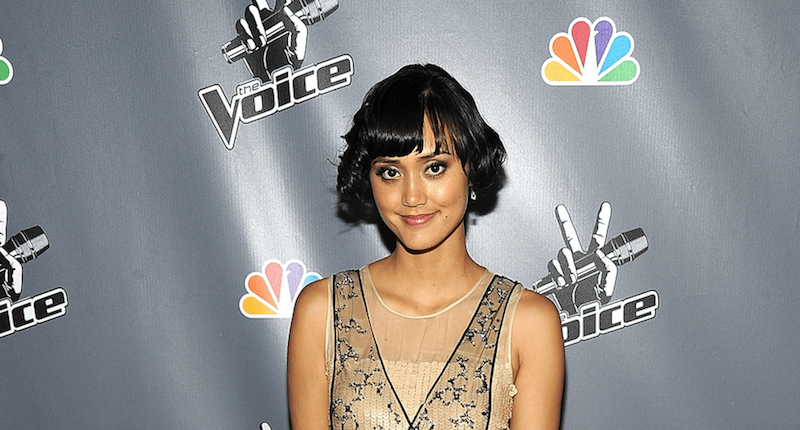 Dia Frampton posing on a red carpet. Dia Frampton posing on a red carpet.