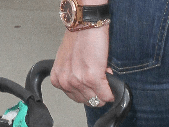Erin Andrews's ring seen on her finger as she pulls her luggage. Erin Andrews's ring seen on her finger as she pulls her luggage.