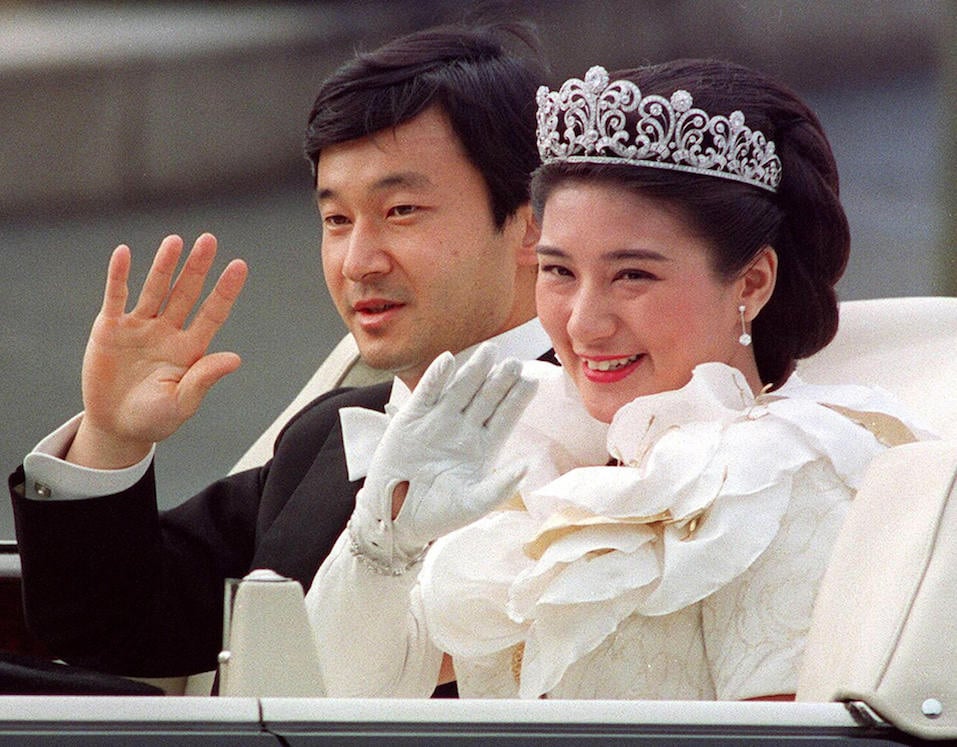 Japanese Crown Prince Naruhito (L) and Crown Princess Masako (R) Japanese Crown Prince Naruhito (L) and Crown Princess Masako (R) waving to people during the parade