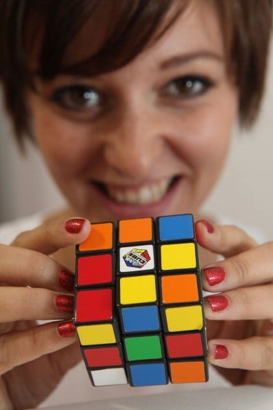 a woman models a rubix cube a woman models a rubix cube