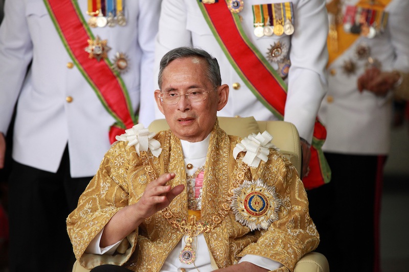 Thailand's King Bhumibol Adulyadej waves