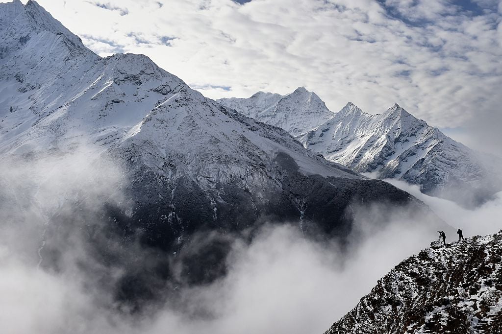 mount everest with mist and climbers mount everest with mist and climbers