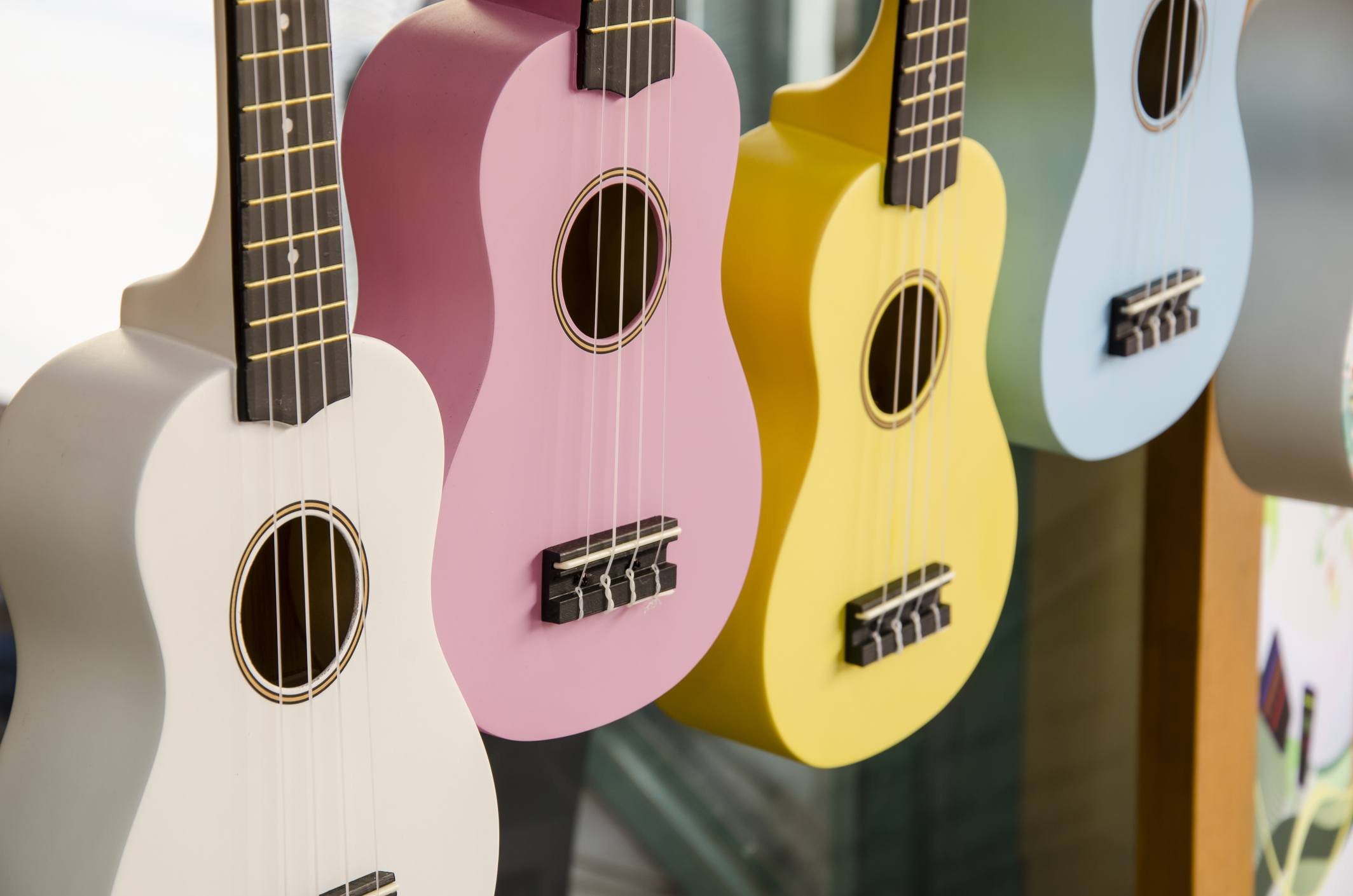 colorful ukuleles hanging