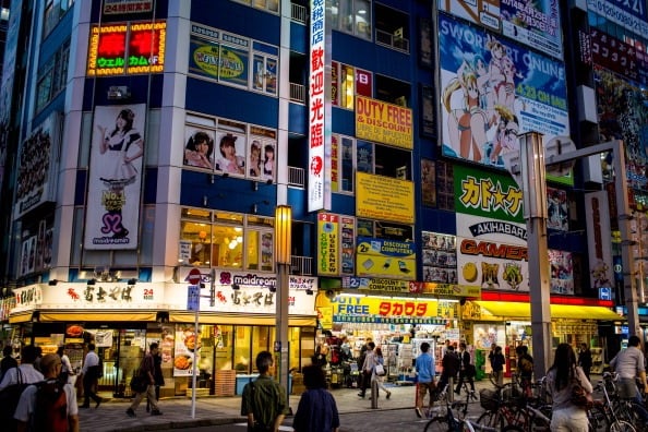 a busy Tokyo street at night a busy Tokyo street at night