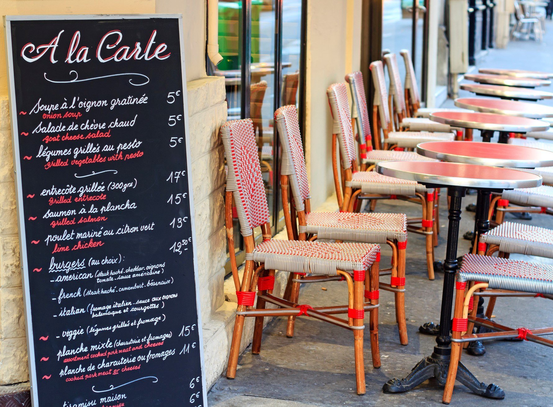A cafe in Paris displaying menu items on a chalkboard
