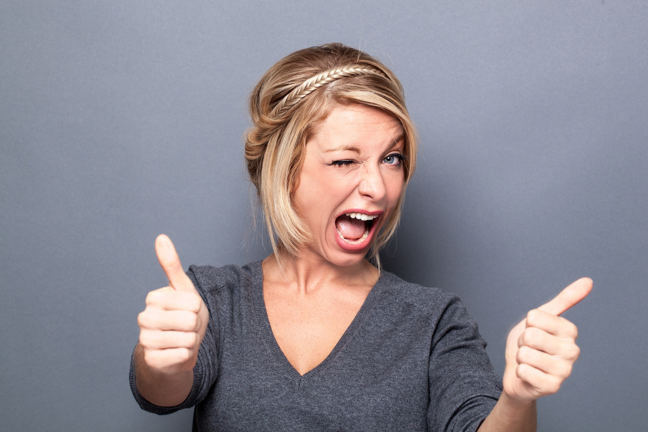 woman giving thumbs up