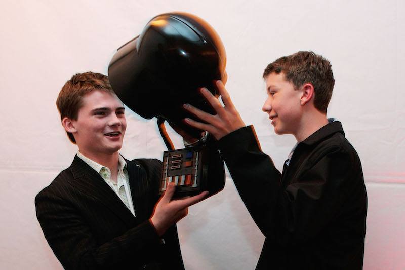 Jake Lloyd posing with a black helmet. Jake Lloyd posing with a black helmet.