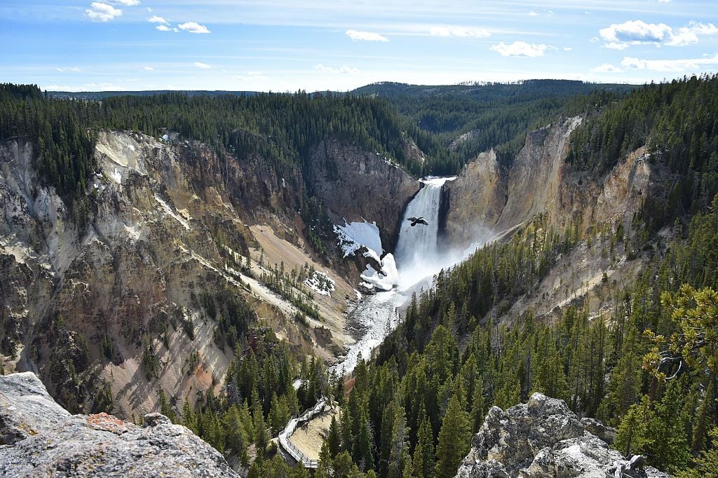 yellowstone national park waterfall with mountains and an eagle yellowstone national park waterfall with mountains and an eagle