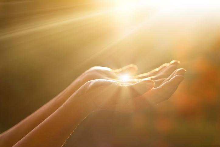 hands with sunlight hitting them