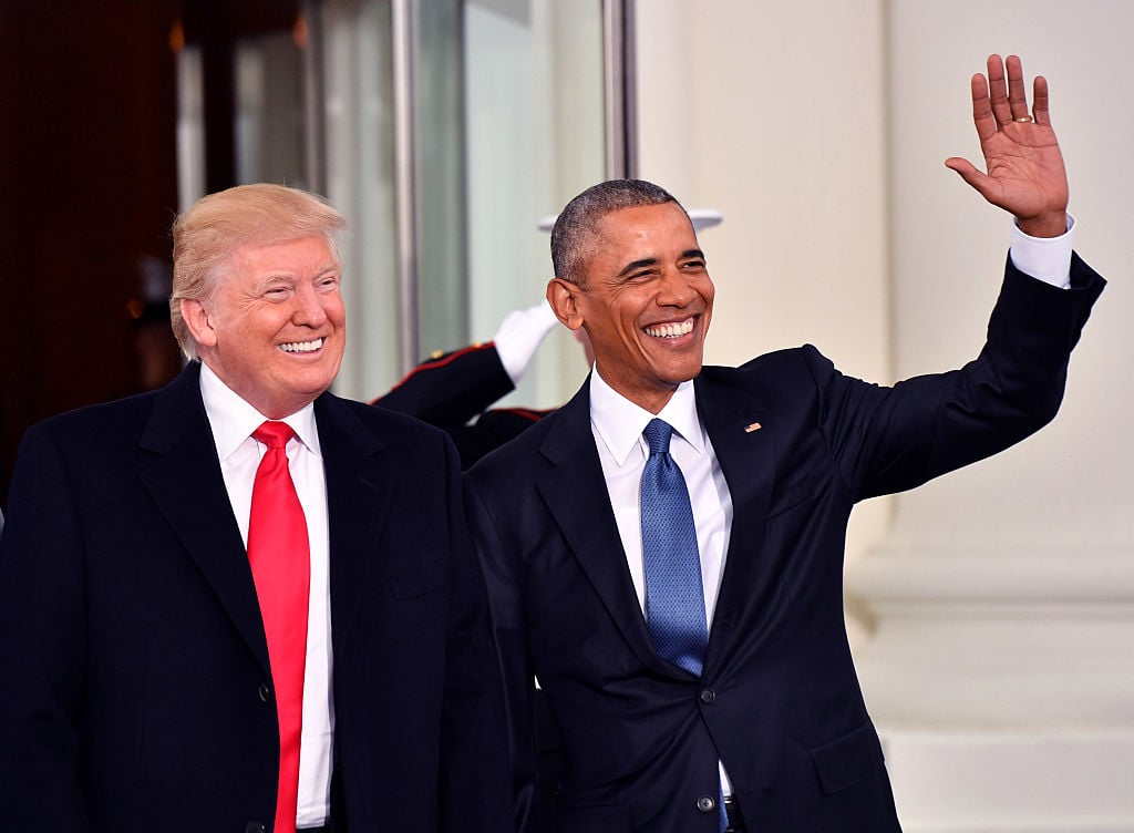 Donald Trump and Barack Obama smiling and waving. 