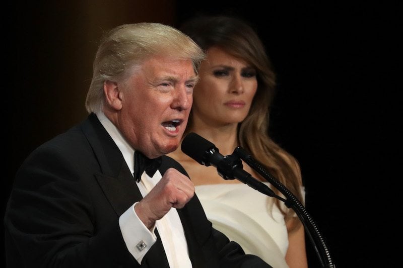 President Donald Trump speaks as his wife First Lady Melania Trump looks on during A Salute To Our Armed Services Inaugural Ball 