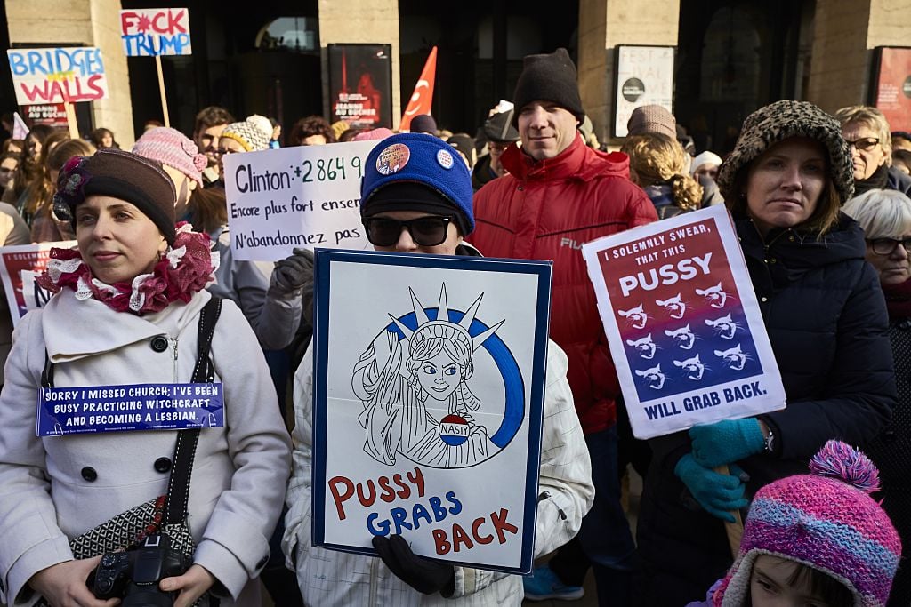 women hold placards during the women's march in January 2016 women hold placards during the women's march in January 2016