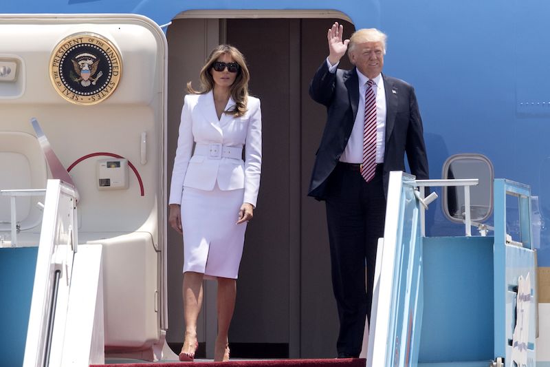 US President Donald Trump and First Lady Melania Trump disembark Air Force One