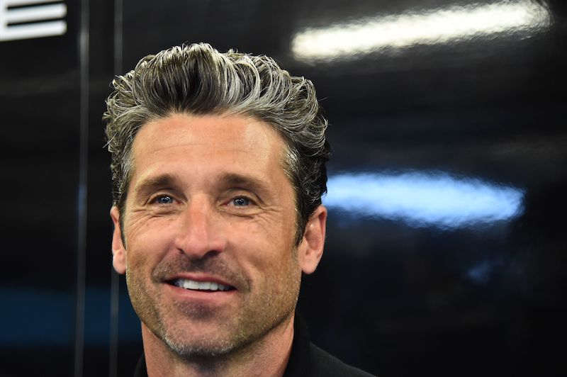 US actor Patrick Dempsey smiles in the pit of Porsche 