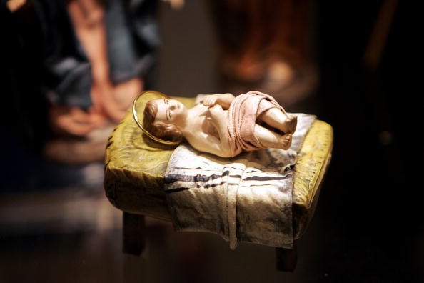 a sculpture of the baby jesus in a nativity set a sculpture of the baby jesus in a nativity set