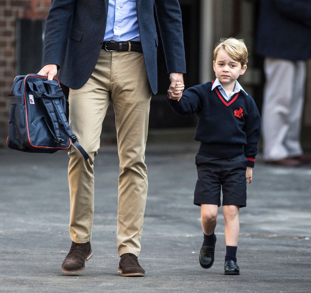 Prince George of Cambridge arrives for his first day of school with his father Prince William, Duke of Cambridge.