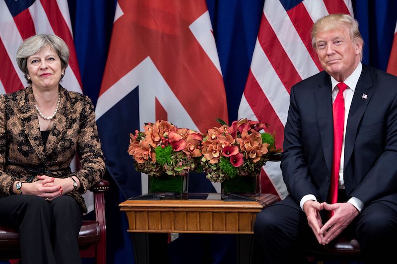 British Prime Minister Theresa May and US President Donald Trump wait for a meetin