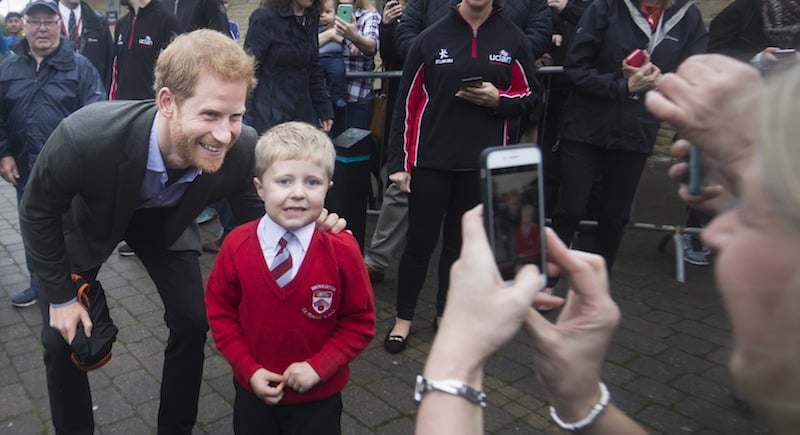 Prince Harry poses with a child as he visits the Sir Tom Finney Soccer Development Centre and the Lancashire Bombers Wheelchair Basketball Club at the University of Central Lancashire (UCLan) sports arena on October 23, 2017 in Preston, England. (Photo by Danny Lawson - WPA Pool/Getty Images) Prince Harry poses with a child as he visits the Sir Tom Finney Soccer Development Centre and the Lancashire Bombers Wheelchair Basketball Club at the University of Central Lancashire (UCLan) sports arena on October 23, 2017 in Preston, England. (Photo by Danny Lawson - WPA Pool/Getty Images)