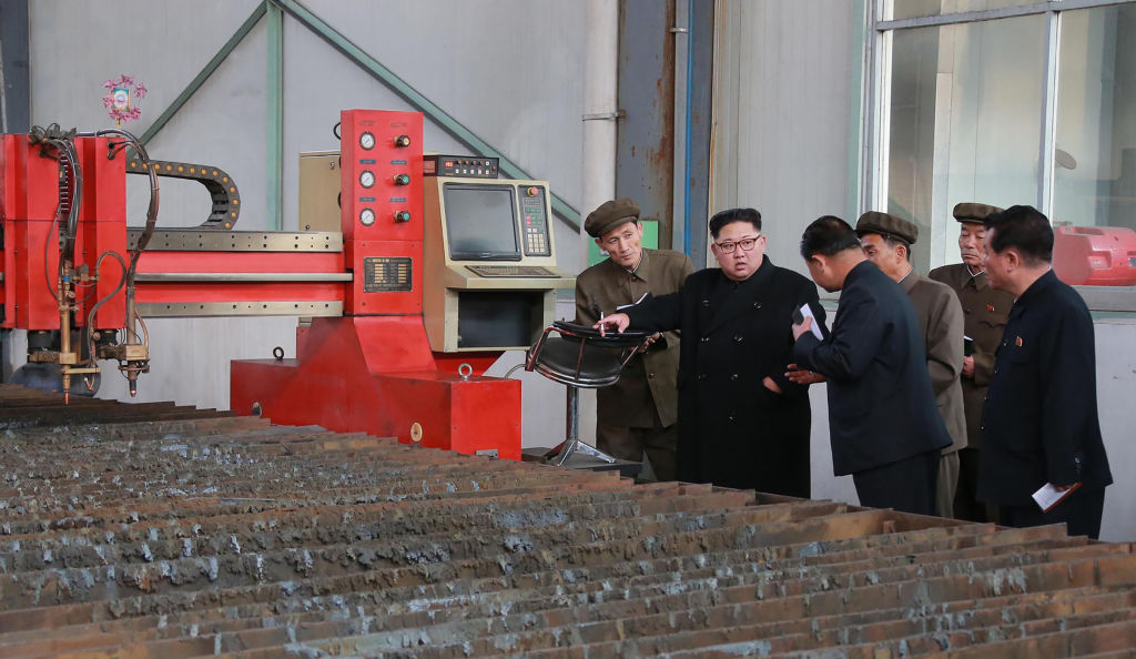 North Korean leader Kim Jong Un visits a factory at an undisclosed place.