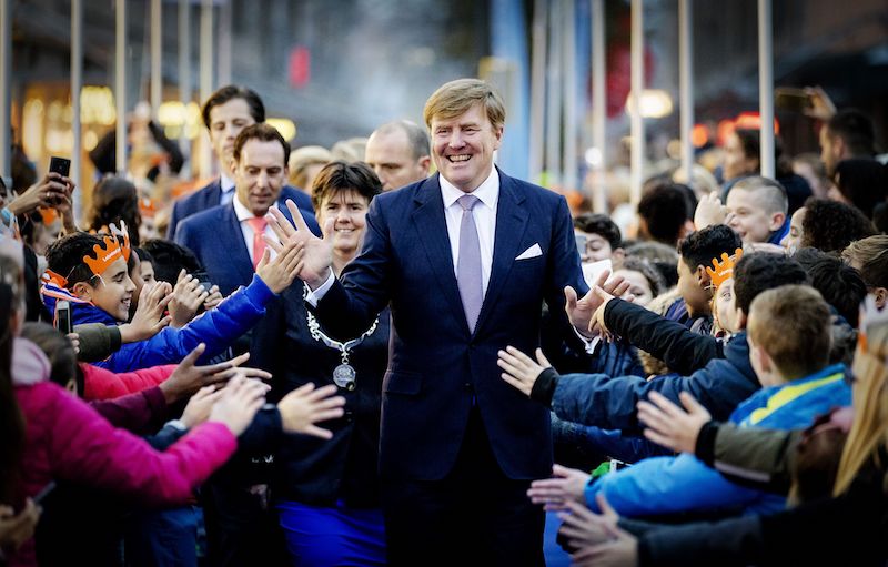 Dutch King Willem-Alexander (C) hands out high fives during the celebration of the 50th anniversary Dutch King Willem-Alexander (C) hands out high fives during the celebration of the 50th anniversary
