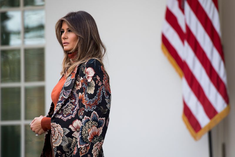 First Lady Melania Trump looks on as US President Donald Trump speaks