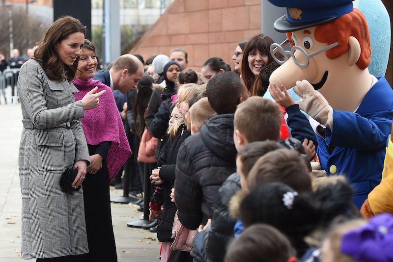Britain's Catherine, Duchess of Cambridge and her husband Britain's Prince William, Duke of Cambridge meet children as they arrive to attend the Children's Global Media Summi