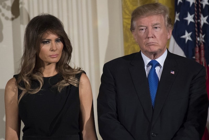 US President Donald Trump and First Lady Melania Trump attend a Hanukkah reception in the East Room of the White House in Washington, DC, December 7, 2017. / AFP PHOTO / SAUL LOEB (Photo credit should read SAUL LOEB/AFP/Getty Images)
