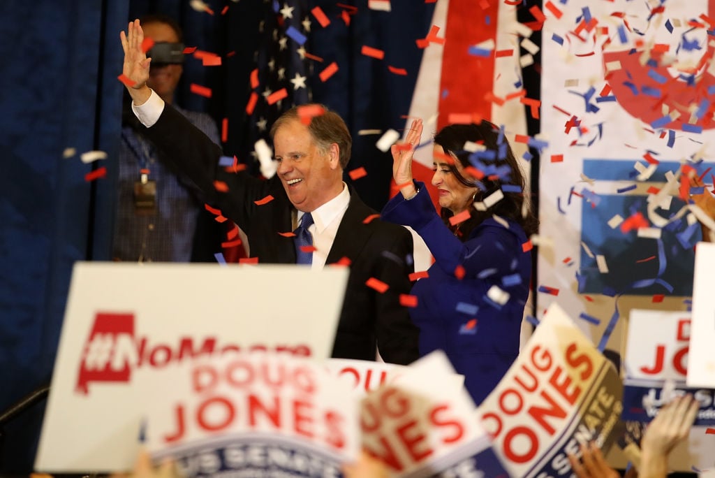 doug jones and his wife celebrate with confetti