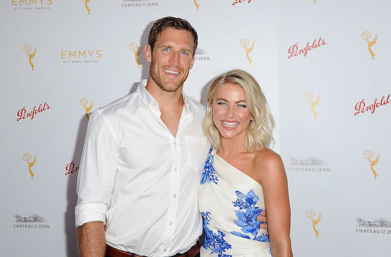 Julianne Hough and Brooks Laich smiling and holding each other as they pose for photographers. Julianne Hough and Brooks Laich smiling and holding each other as they pose for photographers.