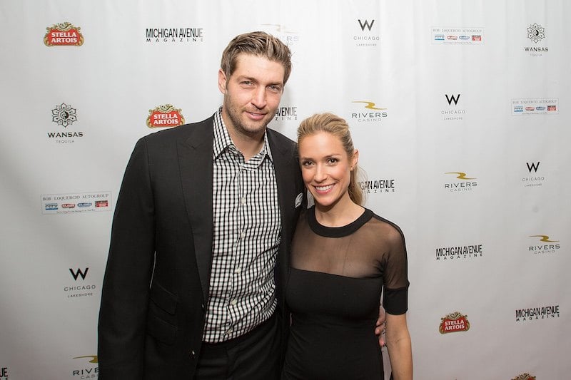 Jay Cutler and Kristin Cavallari posing together on a red carpet. 