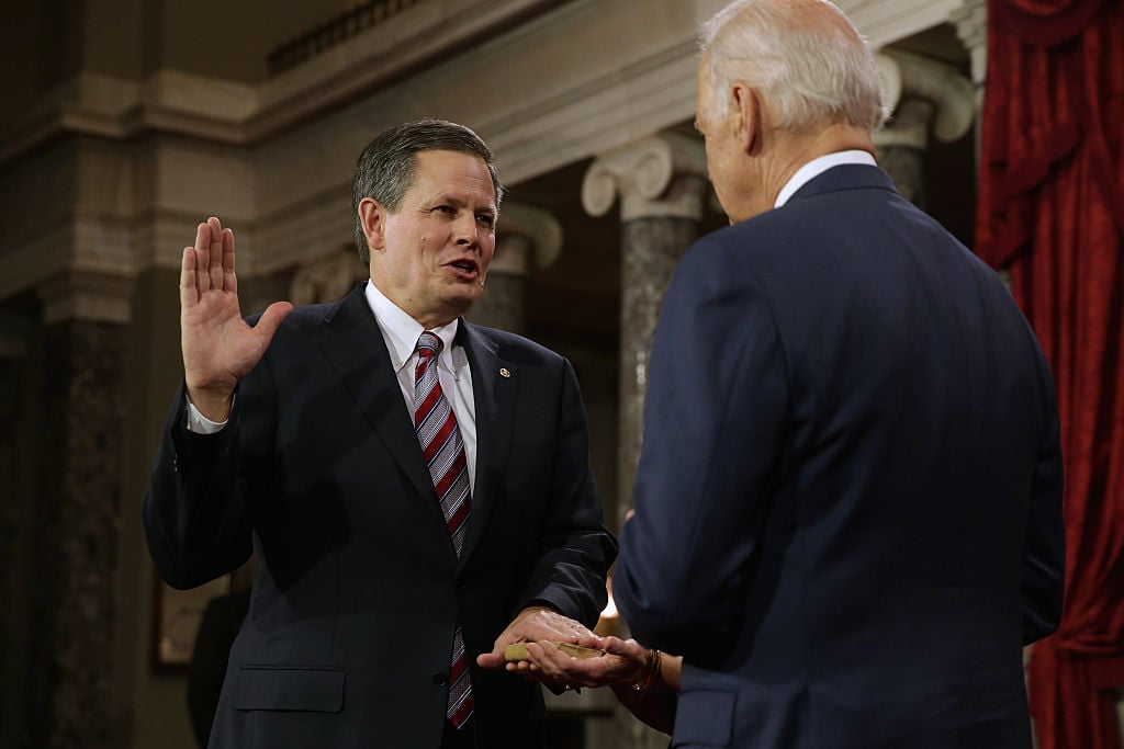 Sen. Steve Daines (R-MT) (L) is ceremonially sworn in by Vice President Joe Biden in the Old Senate Chamber