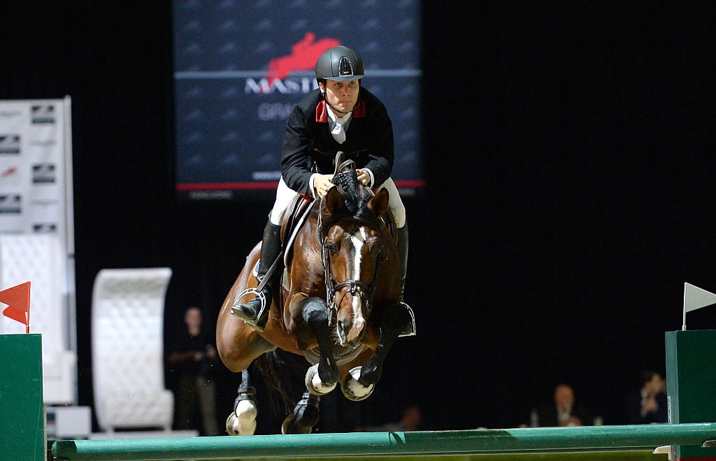 Karl Cook is a professional equestrian Rider Karl Cook rides Jonkheer Z during the Longines Grand Prix class