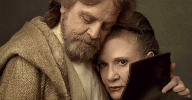 Luke and Leia stand closely together while hugging.